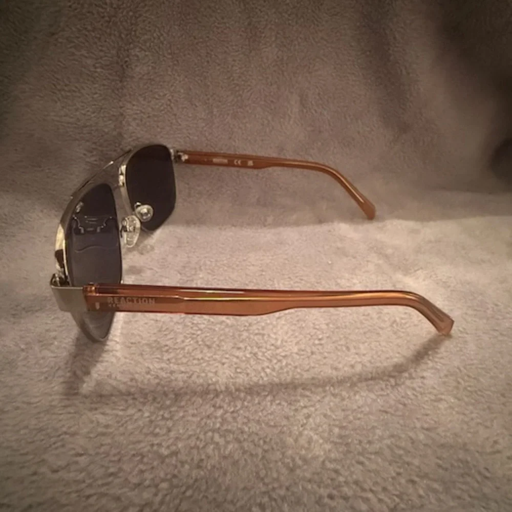 Kenneth Cole Sunglasses, Brown & Silver Colored frame.